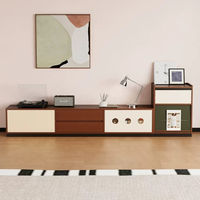 Meuble TV de style Mid-Century, armoire sans poignée à blocs de couleur avec décor rond évidé, tiroirs mixtes et rangement fermé pour appareils multimédias