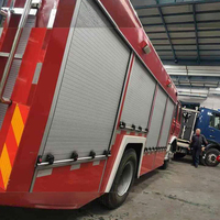 Design moderne, volets roulants en alliage d'aluminium, portes coulissantes manuelles ignifuges et étanches, matériel de verrouillage pour camions de pompiers d'hôtels