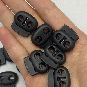หัวเข็มขัดพลาสติกสีดำรูปวงรี 2 รู สำหรับปรับสายรัดด้วยกลไกสปริง - Product Image 3
