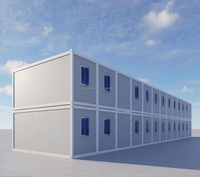 Bureau modulaire élégant à deux étages en conteneur préfabriqué avec mur-rideau en verre bleu, respirant, à assemblage rapide, pour la construction de villas préfabriquées