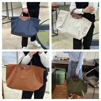 Sac de voyage décontracté personnalisable avec poignée, en nylon imperméable, couleur unie, sac bouffant grande capacité, bagage à bandoulière