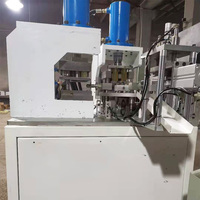 Machine automatique à double station pour la fabrication de connecteurs de câbles et de bornes de fils en cuivre