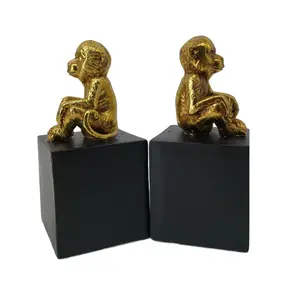 Resin monkey statue sitting on base bookends