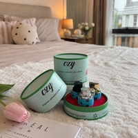 Boîte en carton ronde de luxe avec logo personnalisé, tube en papier cylindrique vert de haute qualité pour l'emballage de flacons de parfum et d'huiles essentielles