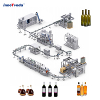 Machine automatique de ligne de remplissage de bouteilles en verre à pression négative pour alcool, liqueur, whisky, gin, vodka, vin, débordement
