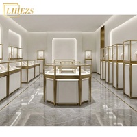 Comptoir de présentation de bijoux en verre trempé blanc or haut de gamme avec rangement intégré
