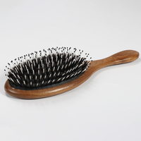Brosse à cheveux ovale en bois de noyer avec coussin d'air, poils de sanglier mélangés et picots en nylon, pour démêlage, massage du cuir chevelu et coiffage, vente en gros