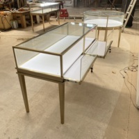 Vitrine de présentation de bijoux haut de gamme en acier inoxydable plaqué titane, verre trempé transparent, éclairage LED pour centres commerciaux