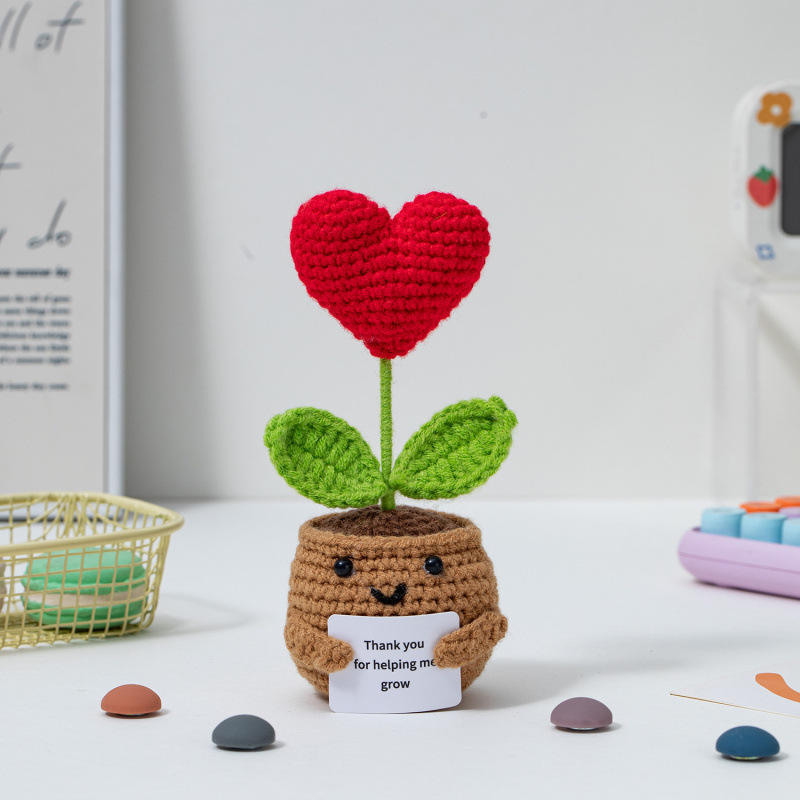 Plante en pot, carte d'amour rouge