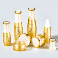 Lujo 40 60 110 130 ML 30 50 G Vacío Redondo Oro Cosmético Loción facial Crema Botella de vidrio Paquete de tarro Conjunto con bomba de loción