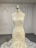 Robe de mariée sirène QUEENS GOWN avec corsage illusion, bretelles spaghetti et traîne florale spectaculaire