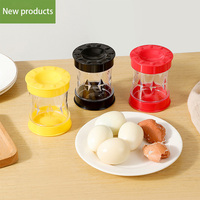 Nouveaux gadgets de cuisine séparateur de coquille d'oeuf rotatif accessoire décapant d'oeuf en plastique éplucheur fendu glisser hors de sa coquille