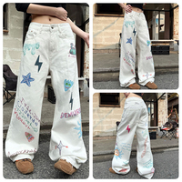 Jean en denim blanc déchiré pour homme, style américain, avec graffiti peint à la main et imprimé dessin animé, coupe ample et jambe large