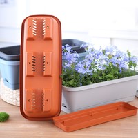 Jardinières rectangulaires en plastique pour balcon domestique – Un outil pratique pour cultiver des légumes sur les balcons