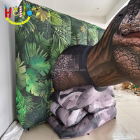 Tête de dinosaure gonflable à décor mural personnalisé avec bouche ouverte et dents pointues