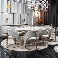 Table à manger de luxe moderne fabriquée en chaîne 8 places avec plateau en marbre blanc pour salle à manger de villa