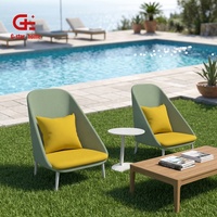Fauteuil de salon de jardin moderne de luxe, confortable, en tissu imperméable, avec dossier haut et structure en aluminium, idéal pour les hôtels.