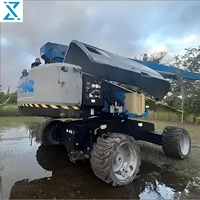 Treuil de chantier diesel Genie S-65XC d'occasion, système de mise à niveau automatique, hauteur de travail de 21,81 m, entretien facile, pompe à engrenages