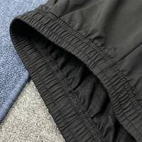 Shorts de sport unisexes légers et respirants en tissu délavé pour l'été