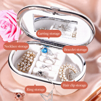 Boîte à bijoux de voyage ovale en cuir, moderne, créative, portable, exquise, pour ranger les bagues, les clous, les pendentifs, les colliers