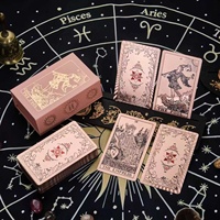 Vente en gros de cartes de tarot classiques en PVC imperméables personnalisées, modèle Soleil Univers Noir Or, emballage en boîte de couleur créative, manuel d'utilisation
