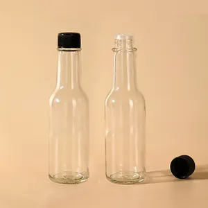 Yuvarlak sıcak cam sos şişesi toptan 5oz 150ml acı biber ketçap sos Woozy şişe ile 24-490 vidalı kapak ve orifis redüktör