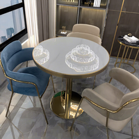 Ensemble table et chaises de luxe en acier inoxydable couleur marbre pour réception commerciale, négociation, restaurant, hôtel, café