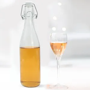 High Quality 250ml 500ml 750ml 900ml Clear Color Round Glass Beer Bottle with Flip Swing Top Caps