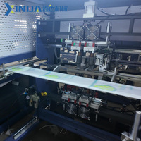 Machine de fabrication de sacs en non-tissé entièrement automatique à découpe en W, contrôlée par PLC, entraînée par moteur et moteur électrique, haute vitesse, pour sacs T-shirt et sacs de courses réutilisables