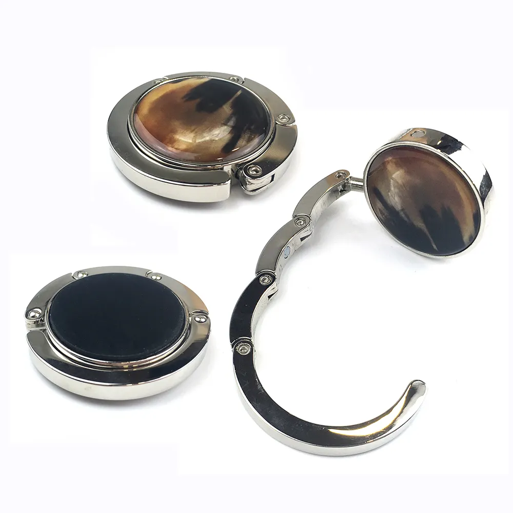 Colgador de bolsas Gancho de metal Accesorios personalizados para bolsas Colgador de bolsas plegable de mesa