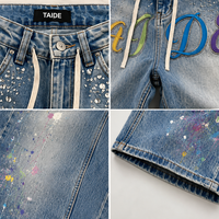 Jean Baggy Large TaiDe SA8000 Audited avec Patch Chenille Multicolore, Strass et Effet Peinture Éclaboussée en Denim pour Homme – Prêt à Expédier