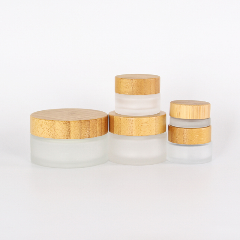 Hot sale cosmetic face cream container 5ml 15ml 30ml 50ml 100ml 200ml frosted clear glass jar with bamboo wood lid