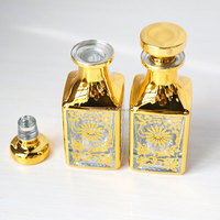 Vente en gros de carafe d'huile de parfum en verre de luxe arabe classique 150ml Uv plaqué or décoratif Attar Display