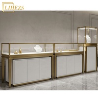 Comptoir de présentation de bijoux en verre trempé blanc or haut de gamme avec rangement intégré