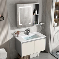 Meuble-lavabo mural pour projet hôtelier, en aluminium étanche, avec vasque en pierre frittée, miroir LED rond et étagère