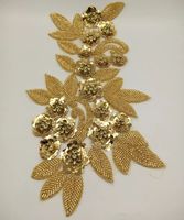Applique perlée dorée fortement perlée, superbe applique dorée sur maille dorée avec motif floral