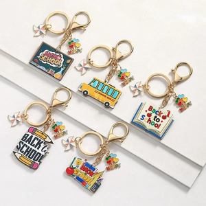 Porte-clés solaire en métal personnalisé et tendance, motif dessin animé, pour la Fête des Enseignants, avec crayon et carnet, idéal comme cadeau pour amis et pour sac à dos scolaire - Product Image 1