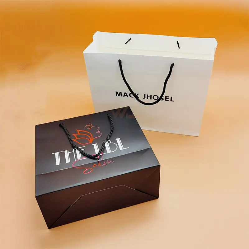 Hot Selling Design schwarzer Karton Weißgold benutzer definierte Ihr eigenes Logo geprägt gedruckt Geschenk einkaufen Luxus Papiertüte mit Bändern
