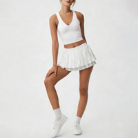 Ensemble de sport pour femme de créateur, couleur unie, avec jupe de tennis et soutien-gorge de sport, séchage rapide, sensation seconde peau, anti-transparence, coupe ajustée, col en V, résistant aux plis