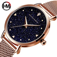 Hannah Martin Montre à cadran pailleté bleu ciel étoilé pour femme Bracelet en maille d'acier inoxydable minimaliste Seiko Quartz 1 an en alliage de verre
