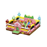 Maison gonflable avec château toboggan, monde de bonbons, château gonflable