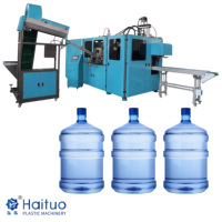 Machine de soufflage de seaux d'eau de 5 gallons entièrement automatique et contrôlée par PLC pour conteneurs d'eau potable en PET, haute performance et robuste