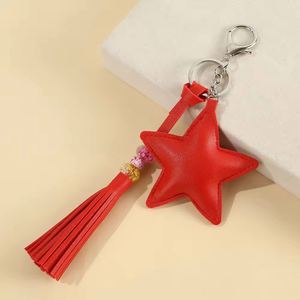 Llavero de PU con borla de cuero sintético y perlas, relleno de felpa, estrella de cinco puntas, para mujer, niña, colgante de bolso - Product Image 5