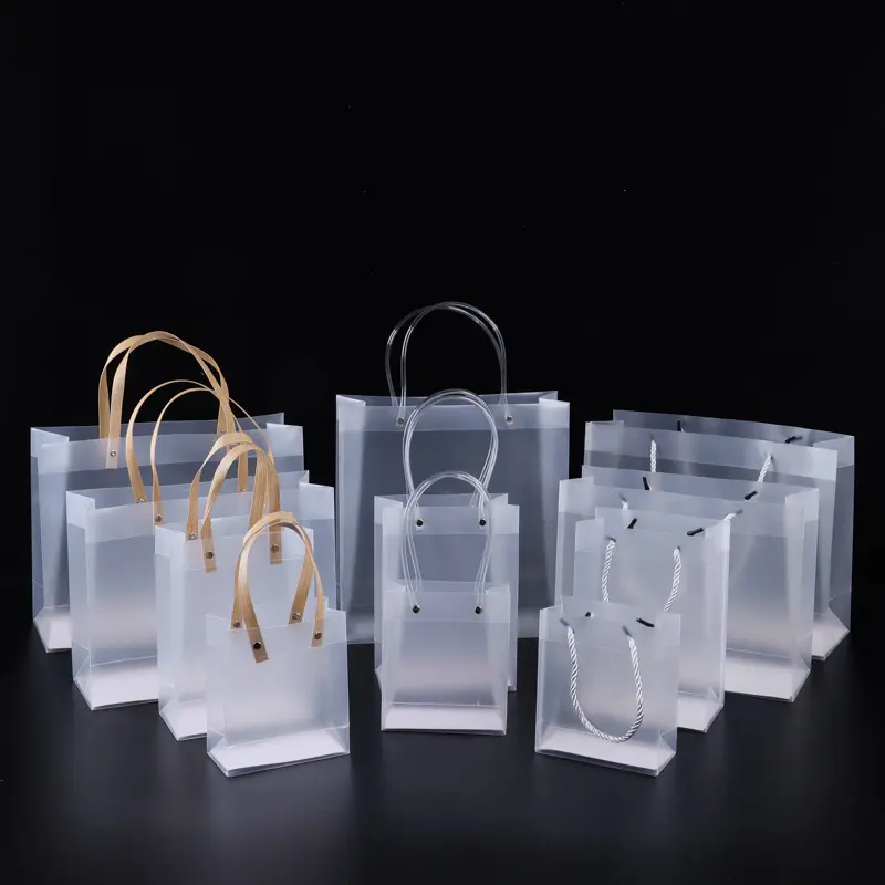 Precio barato impermeable Navidad mate PVC bolsa de embalaje transparente claro esmerilado pequeño regalo bolsos de mano