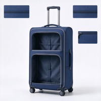 Valise à roulettes souple bleu marine avec deux poches frontales zippées, poignée télescopique et poignée latérale