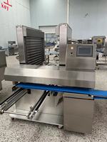 Machine de chargement automatique de plateaux Hengyuan efficace pour le pain, les gâteaux, les pâtisseries et autres produits de boulangerie, capacité essentielle pour le type farineux