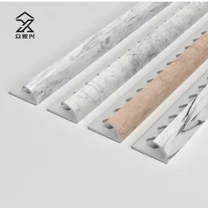 Les prix d'usine imperméabilisent le bord de coins en plastique de garniture de tuile de PVC en céramique de couleur de marbre pour le mur
