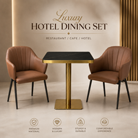 Ensemble table et fauteuils, surface en pierre frittée noire avec base en piédestal doré, mobilier pour café, terrasse et véranda