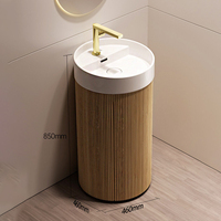 Meuble-lavabo moderne sur pied en bois avec petit lavabo intégré et rangement pour salle de bain