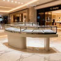 Vitrine à bijoux semi-circulaire avec éclairage LED, étagères à niveaux en acier inoxydable poli pour magasin de détail
